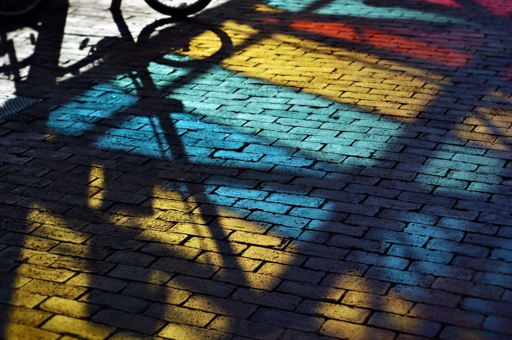 Colored bricks wish shadow cast on them